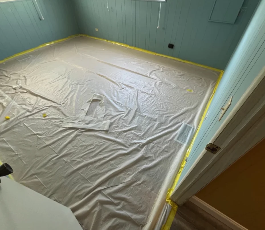 Polyethylene containment barriers installed in an Orlando home before Category 3 sewage cleanup